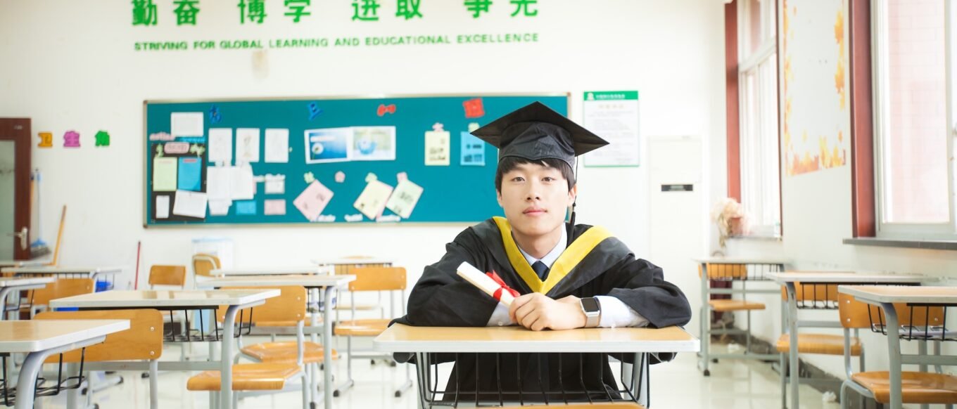 Maple leaf graduation Haonan sitting in the classroom